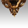 Gilt cartouche shaped mirror base detail