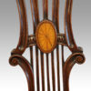 Harlequin set of 14 dining chairs inlaid central splat