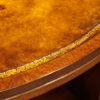 Oval mahogany book centre table top detail
