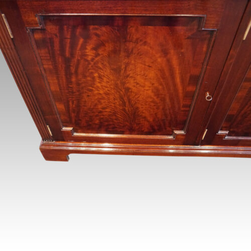 Edwardian mahogany library bookcaseby Warings of Liverpool cupboard door