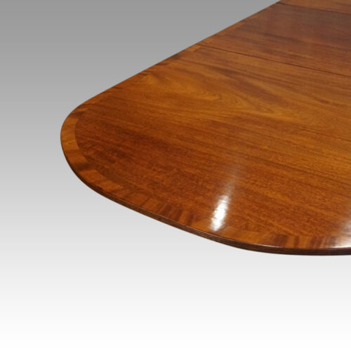 George V mahogany pedestal dining table view of end