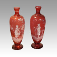 Pair of Mary Gregory cranberry vases young girls