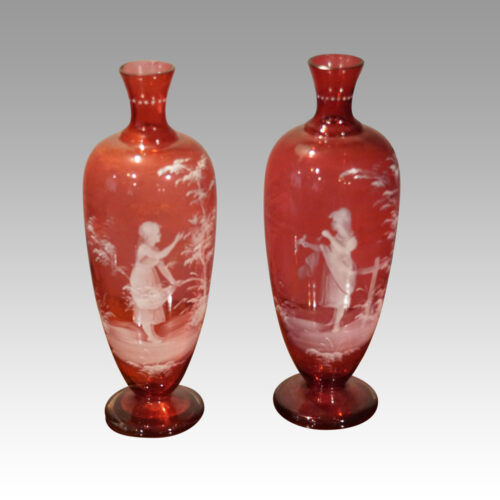 Pair of Mary Gregory cranberry vases young girls