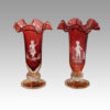 Pair of Mary Gregory fluted cranberry vases