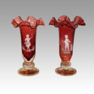 Pair of Mary Gregory fluted cranberry vases