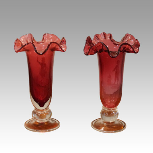 Pair of Mary Gregory fluted cranberry vases rear