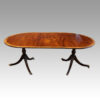 Regency style mahogany deep banded dining table