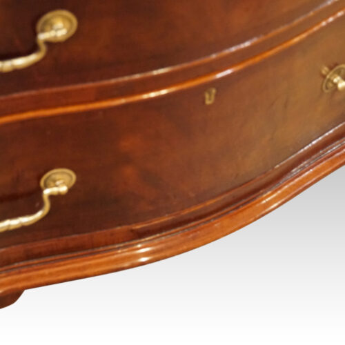 Mahogany serpentine chest apron