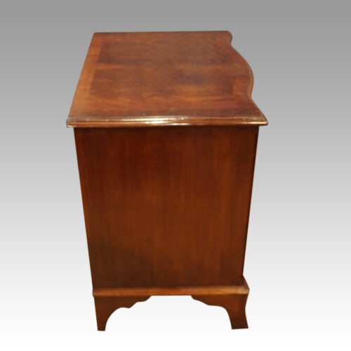 Mahogany serpentine chest side