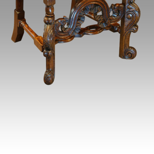 Pair Carolean style oak chairs front detail