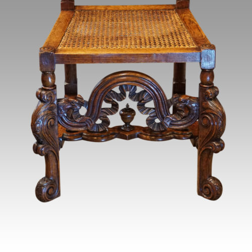 Pair Carolean style oak chairs front rail