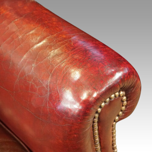 Pair of George VI leather wing chairs arm