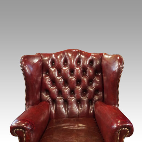 Pair of George VI leather wing chairs back details