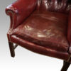 Pair of George VI leather wing chairs cushion