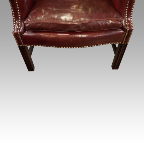 Pair of George VI leather wing chairs front seat