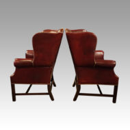 Pair of George VI leather wing chairs side