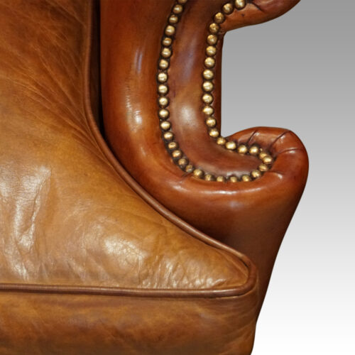 Pair of Georgian style leather wing chairs arm scroll