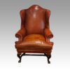 Pair of Georgian style leather wing chairs front