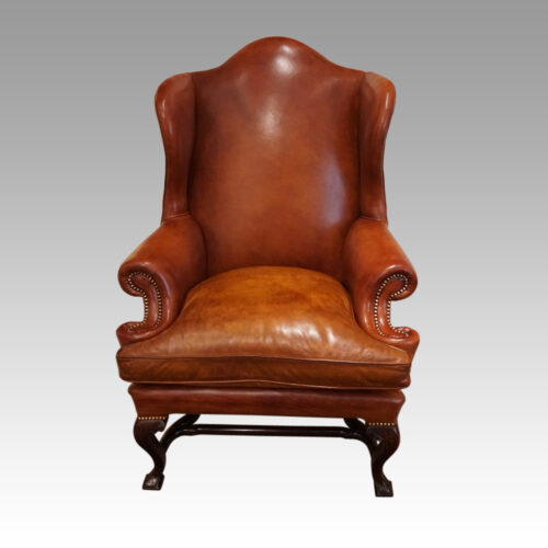 Pair of Georgian style leather wing chairs front