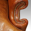Pair of Georgian style leather wing chairs front arm