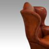 Pair of Georgian style leather wing chairs wings