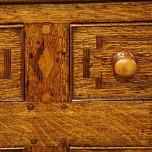 Antique oak inlaid dresser base inlay detail