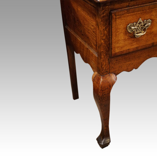 George III oak cabriole leg dresser leg detail