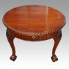 Edwardian oval extending dining table end view closed