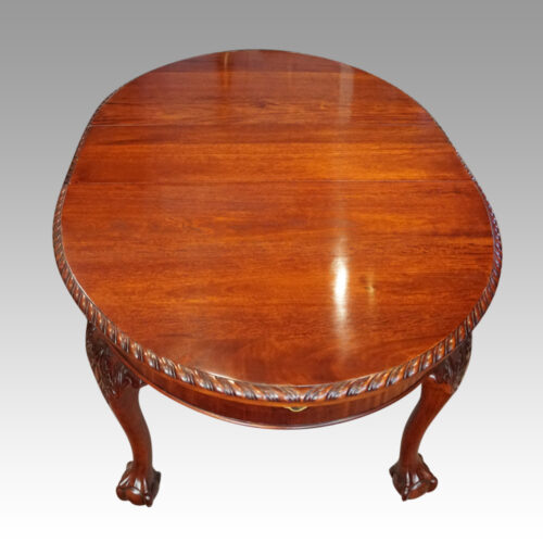 Edwardian oval extending dining table end view one leaf