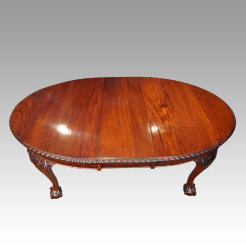 Edwardian oval extending dining table with one leaf