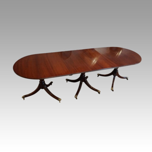 George III mahogany triple pillar dining table