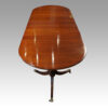 George III mahogany triple pillar dining table end view