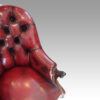 Victorian red leather reading chair arm