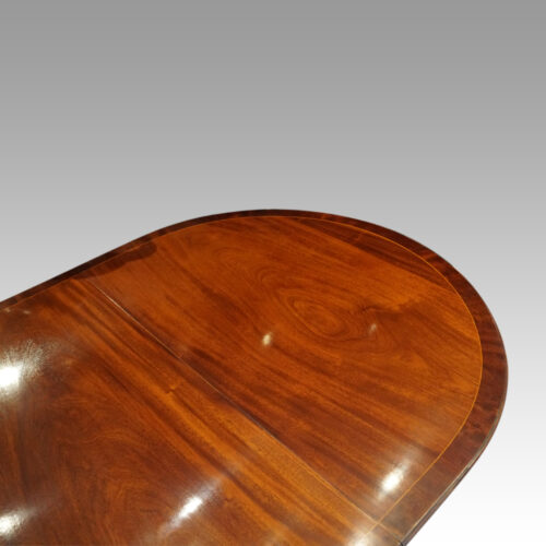 George V mahogany pillar dining table round end