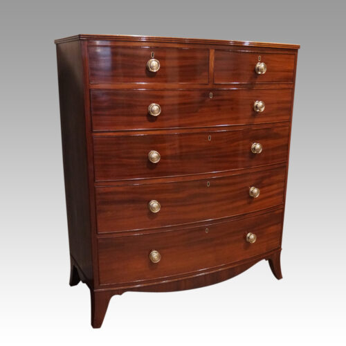 Pair of Georgian bow chests of drawers at angle