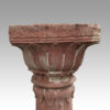 Antique red stone carved column top
