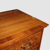 George V walnut chest of drawers top detail