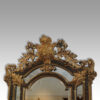 Large gilt cushion mirror cresting