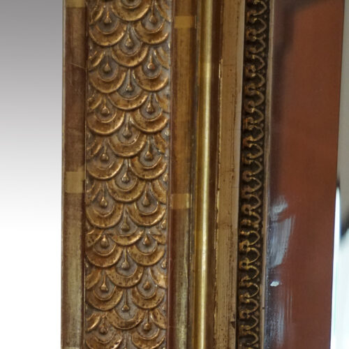 Gilt pier mirror scale decoration detail