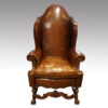 Antique walnut high back leather wingback chair