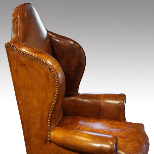 Antique walnut high back leather wingback chair side detail