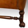 Antique walnut high back leather wingback chair side leg
