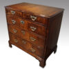 George I walnut chest of drawers at angle