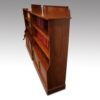 Pair of Edwardian walnut open bookcases front side
