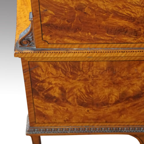 Edwardian satinwood waterfall bookcase carving side