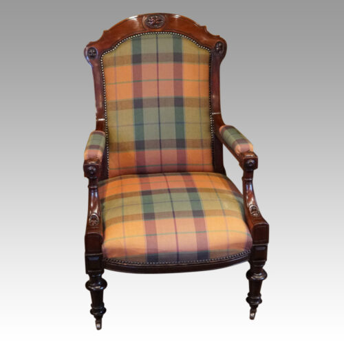 Pair of Victorian mahogany easy armchairs detail