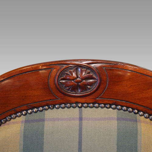 Pair of Victorian mahogany easy armchairs top rail detail