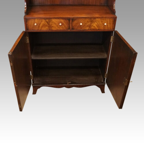 George V mahogany waterfall bookcase interior