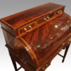 Edwardian inlaid mahogany cylinder desk at angle