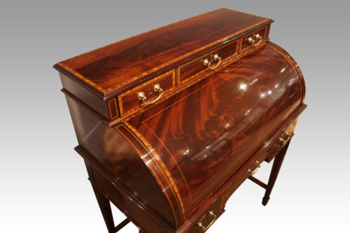 Edwardian inlaid mahogany cylinder desk at angle